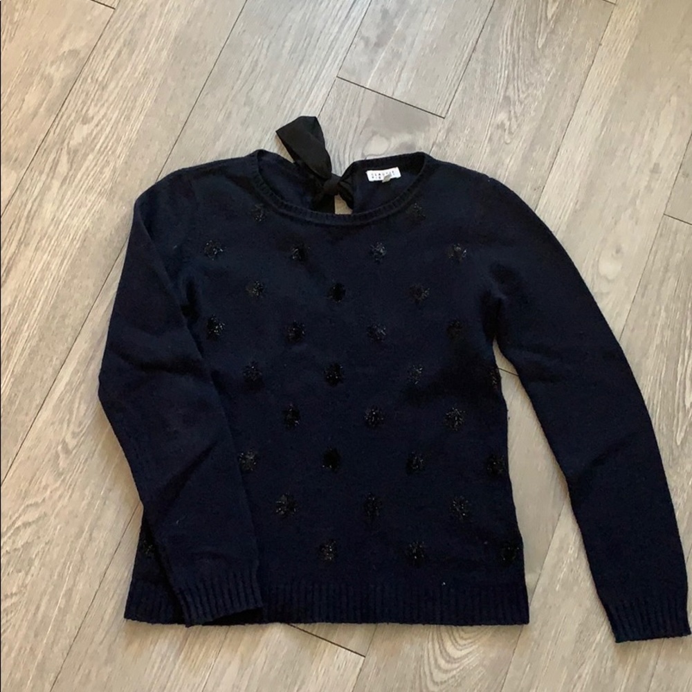Navy lambswool sweater with a bow on back
